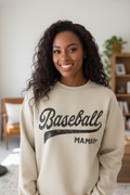 Woman with hair down wearing oat Baseball Mama sweatshirt